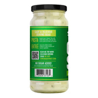 Glass jar of Creamy Spinach Alfredo sauce with a green label featuring serving ideas, a QR code, and a barcode.