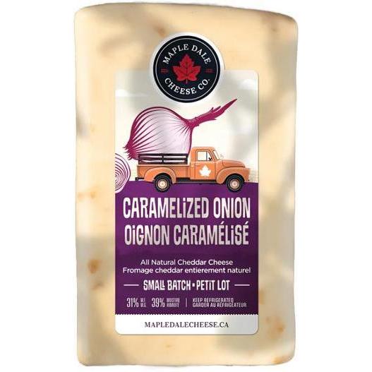 Maple Dale Caramelized Onion cheddar cheese block with a label featuring an orange truck carrying a large onion.