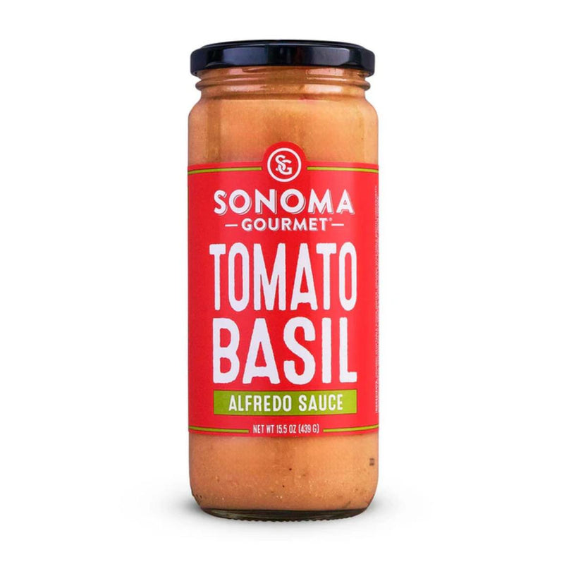 439g glass jar of Sonoma Gourmet Tomato Basil Alfredo sauce with a red label and black lid on a white background.