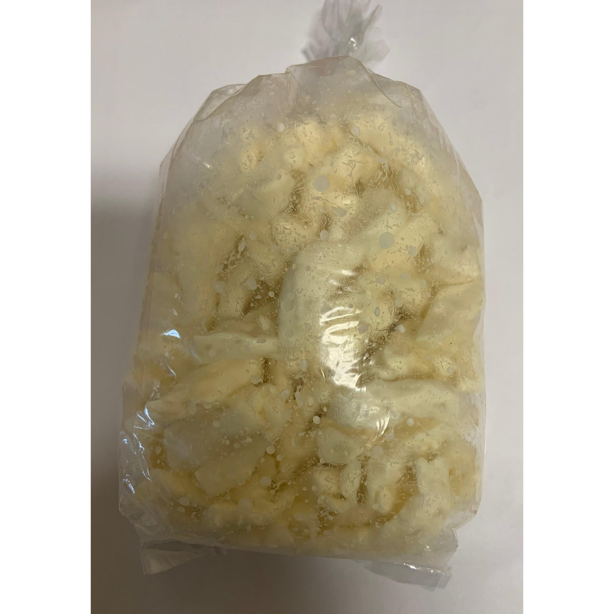Clear plastic bag filled with approximately 300g of white cheese curds.