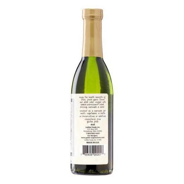 Garlic Expressions Classic Vinaigrette in a tall, dark green glass bottle with a gold cap and white label.