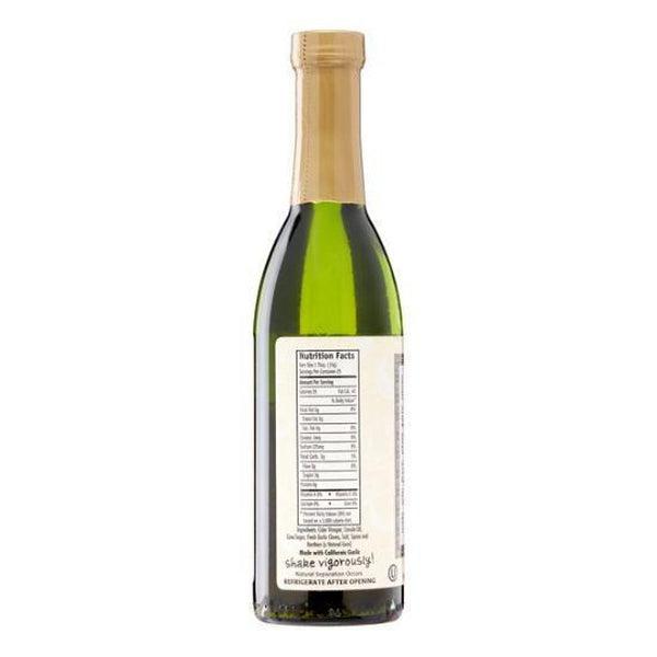 Back of a green glass bottle of Garlic Expressions Classic Vinaigrette with a gold cap and nutrition label.