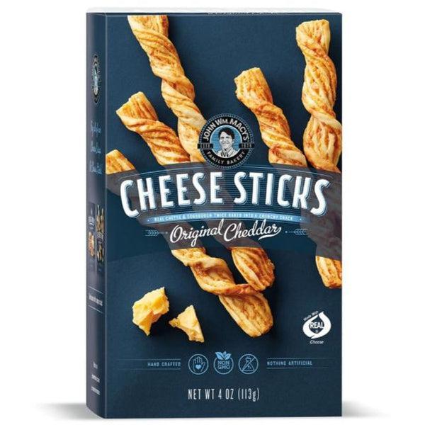 John Wm Macy's Original Cheddar Cheese Sticks box with twisted, golden-brown cheese sticks and cheese chunks.