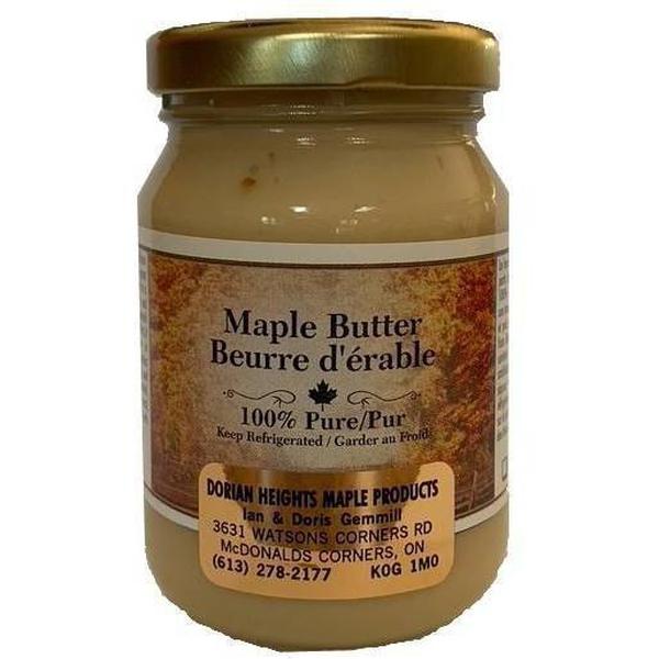 Glass jar of creamy, light brown Pure Maple Butter with a gold lid and rustic label.